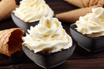 Vanilla soft served ice cream tasty sundae dairy ice cream on rustic background