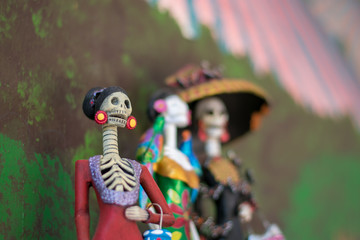 Fototapeta na wymiar La Calavera catrina against a bright background on the Mexican Day of the Dead (Dia de los Muertos) in Jalisco, Mexico.