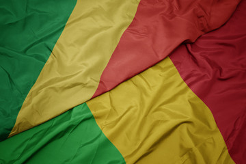 waving colorful flag of mali and national flag of republic of the congo.