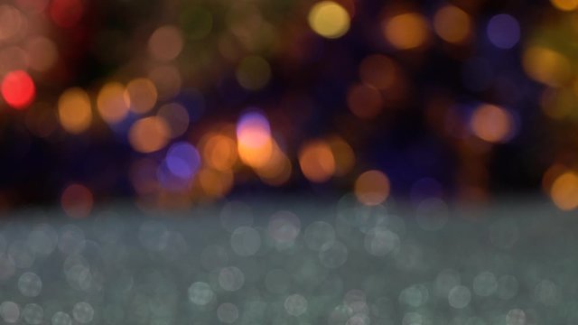 Christmas background with multicolored bokeh lights
