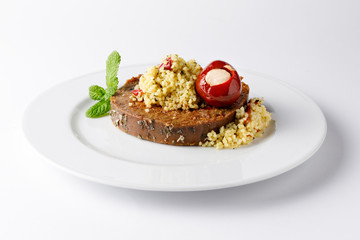 Vegan roast with quinoa salad and stuffed red pepper