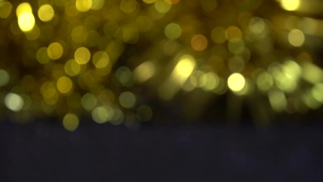 Christmas black background with golden bokeh lights
