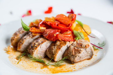 Roasted pork fillet with vegetables on a plate