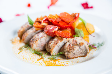 Roasted pork fillet with vegetables on a plate