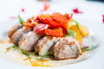 Roasted pork fillet with vegetables on a plate