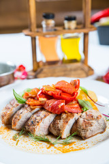 Roasted pork fillet with vegetables on a plate