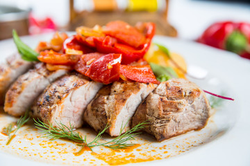 Roasted pork fillet with vegetables on a plate