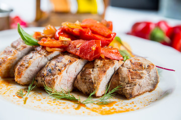 Roasted pork fillet with vegetables on a plate