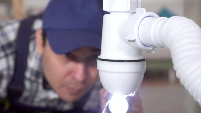 plumber discovered a water leak problem slow mo