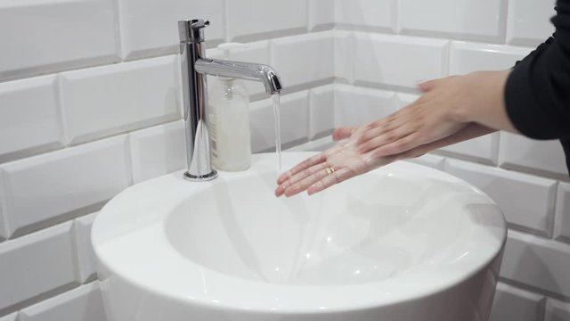 washing hands in a sink