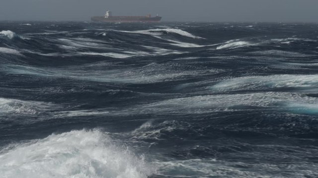 Large Container Ship Heading In Rough Sea On Tailwind