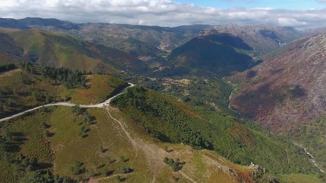 rocky mountain ridges pine tree  forest peneda geres Portugal aerial shot 4k