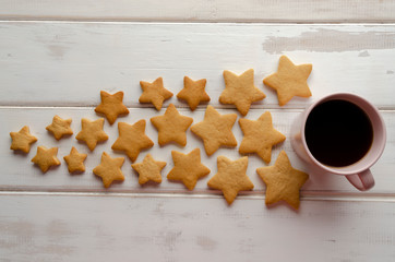 Cup of coffee and gingerbread cookies Top view