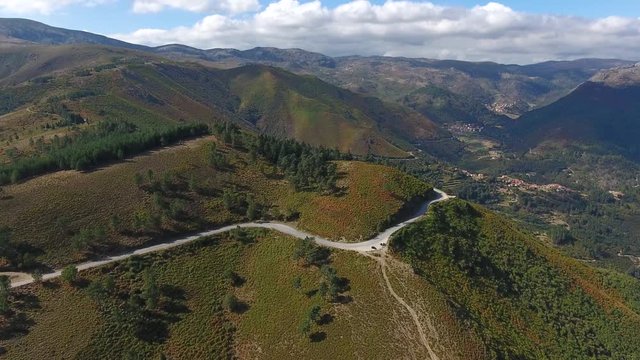 rocky mountain ridges pine tree  forest peneda geres Portugal aerial shot 4k