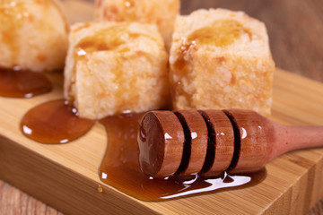 Tapioca cubes, Brazilian snack with honey, dadinho de tapioca