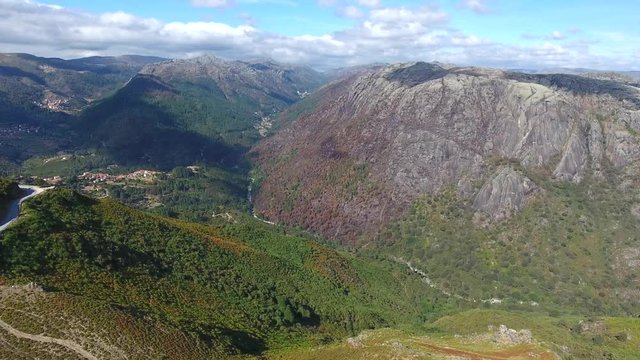 rocky mountain ridges pine tree  forest peneda geres Portugal aerial shot 4k