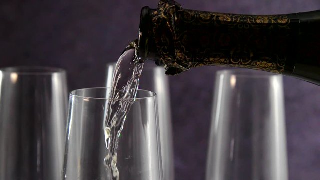 Pouring Champagne into Glass in Slow Motion