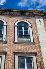 Traditional architecture of the facades covered with ceramic tiles called azulejos in the city of Lisbon in Portugal