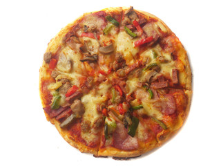 Pizza in round shape, topped with meat, ham, mushroom and veggies