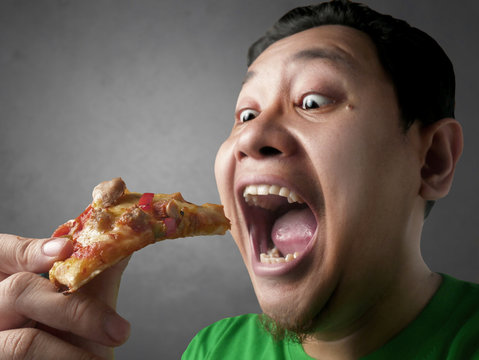 Funny Asian Man Eating Pizza