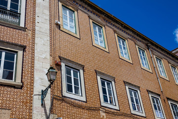 Traditional architecture of the facades covered with ceramic tiles called azulejos in the city of Lisbon in Portugal
