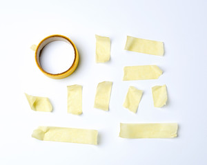 set of various pieces of yellow sticky paper tape on a white background