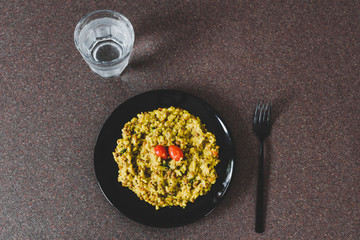 curry rice with cherry tomatoes and herbs