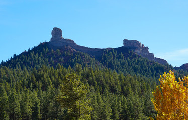 A beautiful mountain in Pagosa Springs, Colorado has a thick forest covering it's sides, and Chimney Rock on it's top.