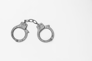 Handcuffs on white background isolate, copy space