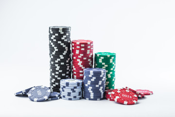 Poker chips on a white background different stacks of isolate