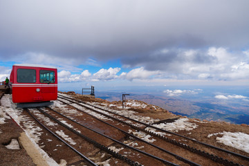 A high mountain train waits at the summit to start it's journey back down.
