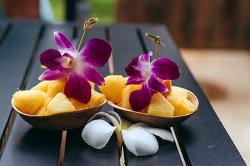 pineapple fruit bowl with edible arrangements orchids - Powered by Adobe