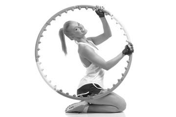 young sporty woman with hula hoop