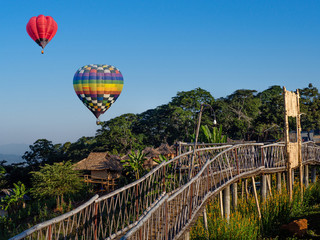 Hot air balloons on blue sky at Ban Doi Sa-ngo Chiangsaen, Chiang Rai Province, Thailand.