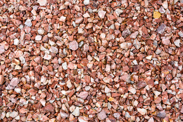 Red, white granite fine gravel, simple stone background, pebbles stone texture