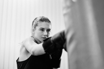 Fototapeta na wymiar young female keeping fit boxing