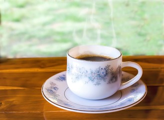 cup of coffee on wooden table