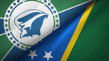 Martinique and Solomon Islands two flags textile cloth, fabric texture