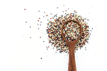 quinoa in spoon on white background.