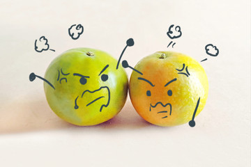 2 Oranges argue brawl together with angry face