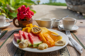 Tropical fruits on a breakfast plate, close up