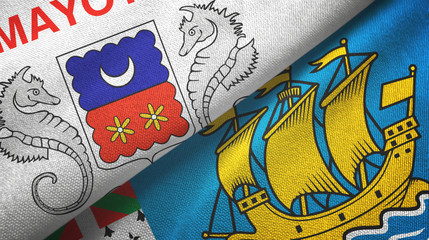 Obraz premium Mayotte and Saint Pierre and Miquelon two flags textile cloth, fabric texture