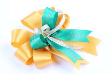 green & yellow color ribbon bow on white background