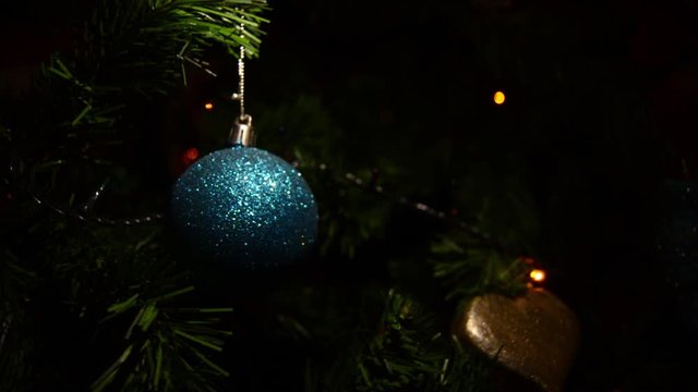 Shiny Blue Ball Ornament on Christmas Tree, New Year Holidays Traditional Decoration Detail, Close Up