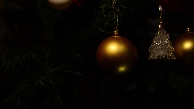 Christmas Tree Decoration Details, Golden Ball and Colorful Lights in Background, Merry Christmas and Happy New Year Concept