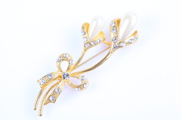 Flower brooch on white background
