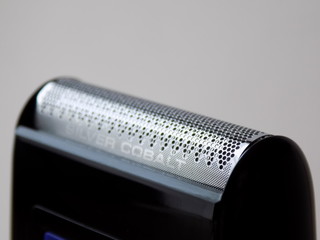 close up of a electric shaver on white background