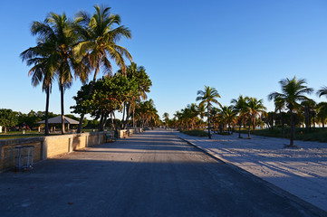 Concrete beachside promenade at Crandon Park Beach in Key Biscayne, Florida on a clear cloudless winter day.