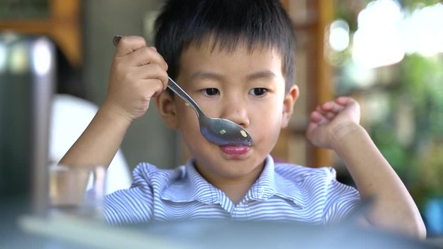 Asian Boy About 3 Year And 10 Months Eating Stir Fried Rice Or Food By Himself