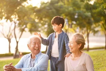 Foto op Canvas asian grandparents enjoying good time with grandson © imtmphoto